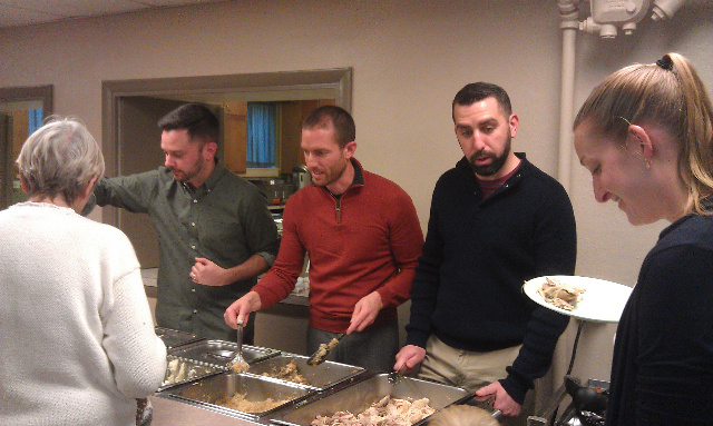 Matt Adam and Matt serving food